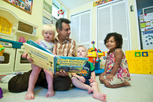 man reading to children – happy